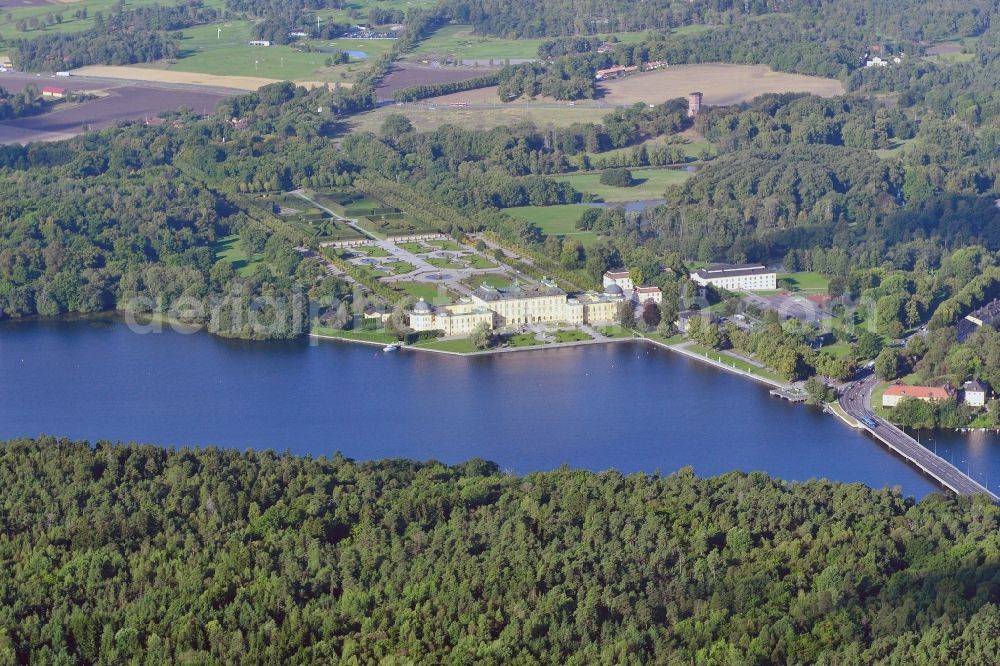 Aerial photograph Drottingsholm - Drottningholm Palace was originally a royal summer residence on the island Lovoen in Maelaren in the municipality of Ekeroe and is since 1982 the residence of the Swedish royal family. Drottningholm was included as the first Swedish cultural monument in the List of World Heritage by UNESCO, due to two specific buildings, the Chinese small castle and the Drottningholmtheaters. Drottningholm Palace is also called the Swedish Versailles