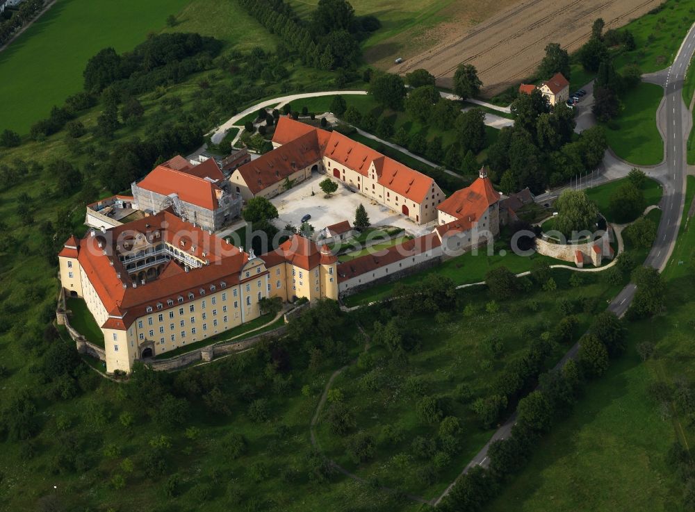 Aerial photograph Ellwangen - Castle Ellwangen east of Ellwangen in the state of Baden-Württemberg. The baroque castle is the landmark of Ellwangen, together with the adjacent church. The compound is located on a hill and was built in the Renaissance style and later refurbished in a baroque style. Today, there are several communal offices and the castle museum