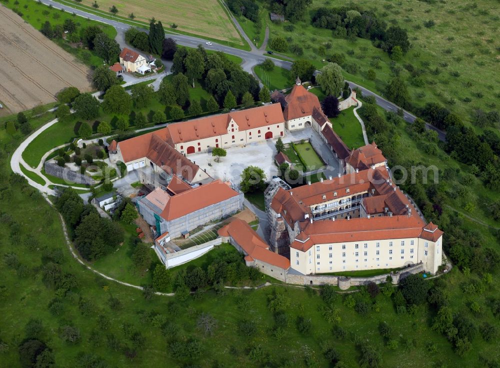 Ellwangen from above - Castle Ellwangen east of Ellwangen in the state of Baden-Württemberg. The baroque castle is the landmark of Ellwangen, together with the adjacent church. The compound is located on a hill and was built in the Renaissance style and later refurbished in a baroque style. Today, there are several communal offices and the castle museum