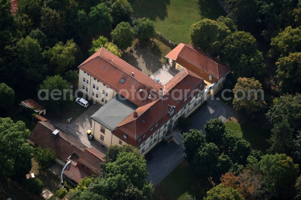 Aerial image Grüningen - Care facility Castle Grueningen in the East of Grueningen in the state of Thuringia. The care facility is being run by Novalis Diakonie as Castle Sophie von Kuehn and is located in a forest on the Eastern edge of the village