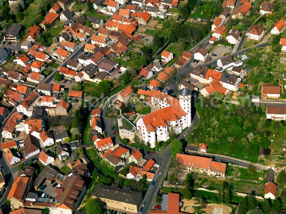 Rimpar from above - Castle Grumbach in the town of Rimpar in the state of Bavaria. The fortress is owned by the borough and is its most famous landmark. It has been built in the 14th century and is home to an archeological museum and a bakery museum. Well known is its white tower and the surrounding wall. It also has two Renaissance knight's halls