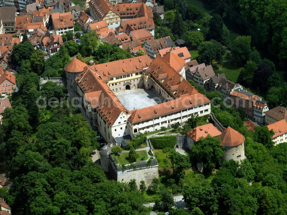 Tübingen from the bird's eye view: Hohentübingen Castle in the city centre of Tübingen in the state of Baden-Württemberg. The castle is an architectural mixture of a middle age fortress, a residence and palais. It is located on a hill close to the river Neckar in the historical centre, surrounded by historical buildings and frame houses