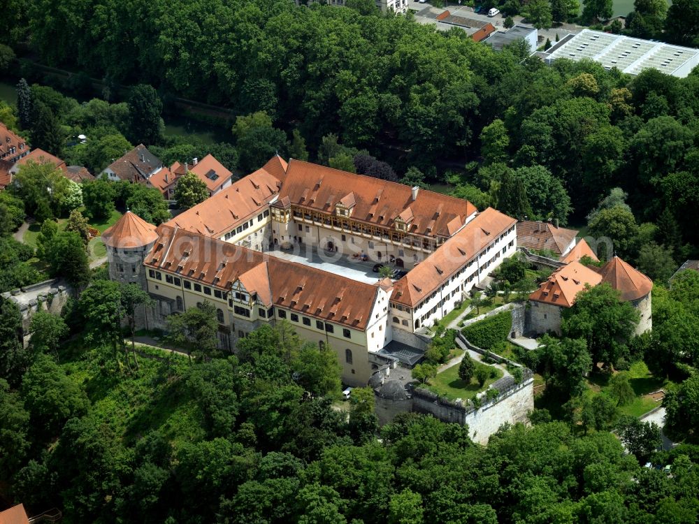 Aerial image Tübingen - Hohentübingen Castle in the city centre of Tübingen in the state of Baden-Württemberg. The castle is an architectural mixture of a middle age fortress, a residence and palais. It is located on a hill close to the river Neckar in the historical centre, surrounded by historical buildings and frame houses