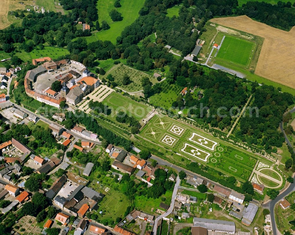 Aerial image Haldensleben - Castle Hundisburg in the town of Haldensleben in the state of Saxony-Anhalt. The park, compound and buildings as well as the courtyard in the southern part of Hundisburg in the town of Haldesleben. The compound is surrounded by trees and gardens near the town centre. It is one of the most important baroque castles in the state and is currently being refurbished after its destruction in 1945