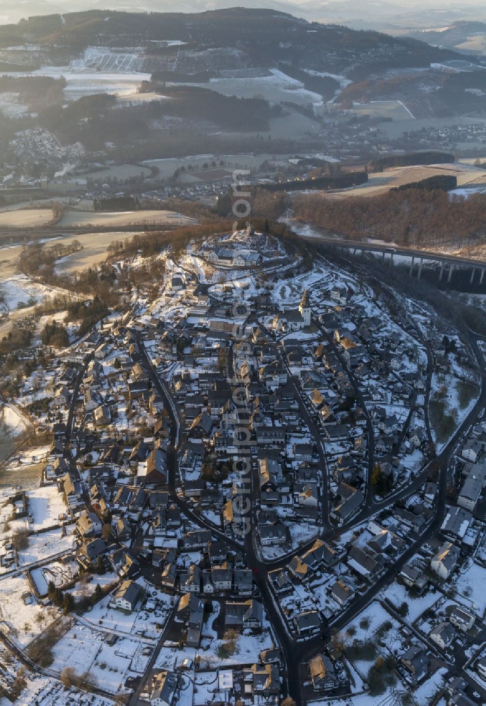 Aerial image Meschede - Winter landscape with view of the Eversberg Castel and Eversberg church covered with snow in Meschede in North Rhine-Westphalia