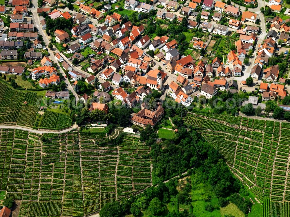 Aerial photograph Ingersheim - Kleiningersheim Castle in the Kleiningersheim part of the town of Ingersheim in the state of Baden-Württemberg. Overview of the town part and fields on the western riverbank of the river Neckar. Originally built as a fortress, site was later converted to a castle with a tower and a rectangular courtyard. It is Wolfgang Gerberely owned