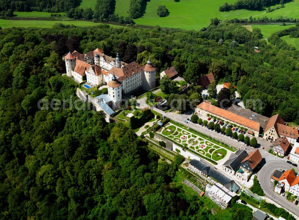 Aerial image Langenburg - Castle Langenburg in Langenburg in the state of Baden-Württemberg. The castle is located on a mountain high above the Valley of the Jagst. It is the residence of the family Hohenlohe-Langenburg. Originally built as a fortress it was redesigned in the baroque style including a distinct garden and park amidst the forest. Publicly open are the museum, café, the German Automobile Museum as well as the main hall for concerts. The compound is also the site of the Gartentage a gardening festival and exhibition