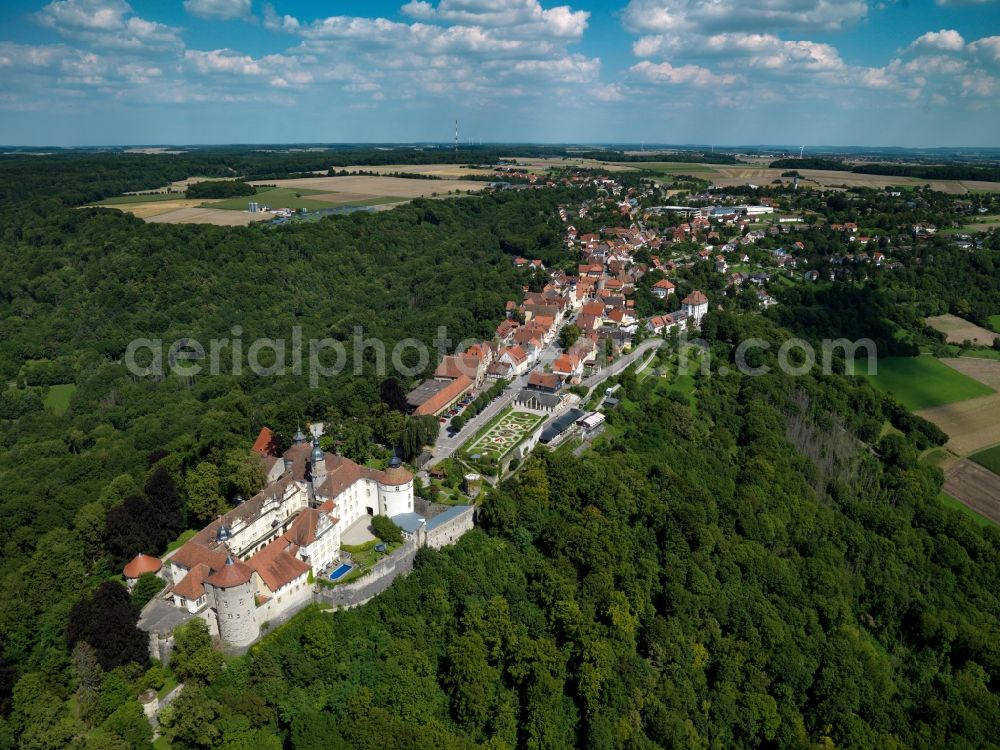 Langenburg from above - Castle Langenburg in Langenburg in the state of Baden-Württemberg. The castle is located on a mountain high above the Valley of the Jagst. It is the residence of the family Hohenlohe-Langenburg. Originally built as a fortress it was redesigned in the baroque style including a distinct garden and park amidst the forest. Publicly open are the museum, café, the German Automobile Museum as well as the main hall for concerts. The compound is also the site of the Gartentage a gardening festival and exhibition