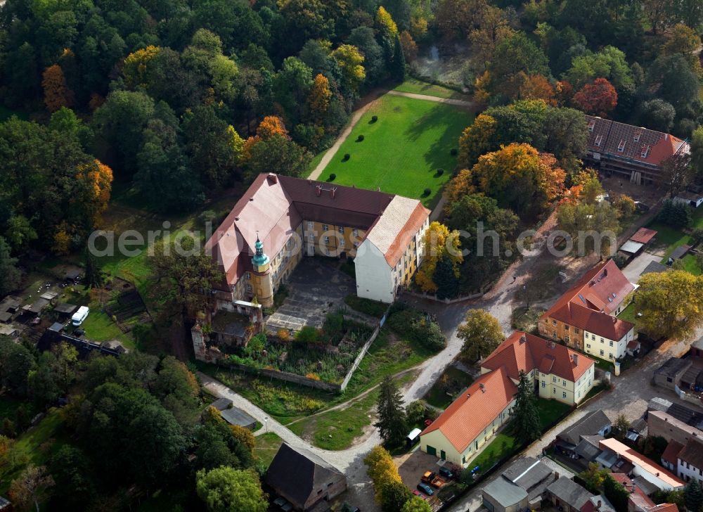 Lieberose from above - Lieberose Castle in the city of Lieberose in the state of Brandenburg. The castle and its park are tourist attractions of the city. It is located within a garden compound at the outskirts of the city, enclosed by residential buildings and historical buildings