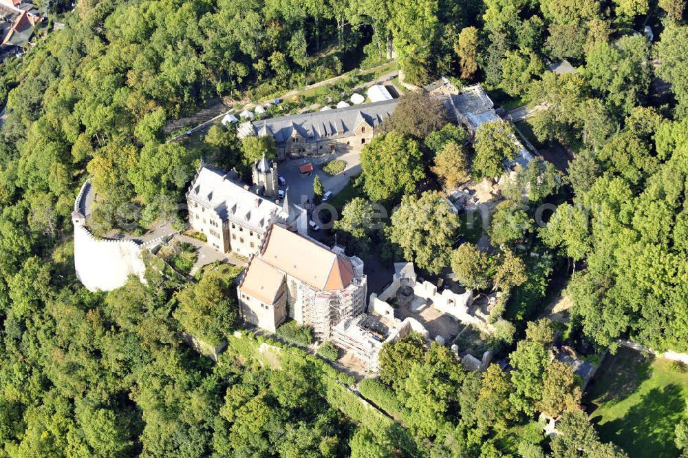 Mansfeld from the bird's eye view: Die, im Zustand der Sanierung befindliche, Burg Mansfeld in Mansfeld, Sachsen-Anhalt. Seit 1999 ist das Schloss Eigentum des Fördervereins Schloss Mansfeld e.V. und ist heute eine christliche Jugendbildungs- und Begegnungsstätte. Castle Mansfeld in the state of renovation in Mansfeld, Saxony-Anhalt. Since 1999 the castle is property of the society Förderverein Schloss Mansfeld e.V. and today it is a christian youth educational and community center.