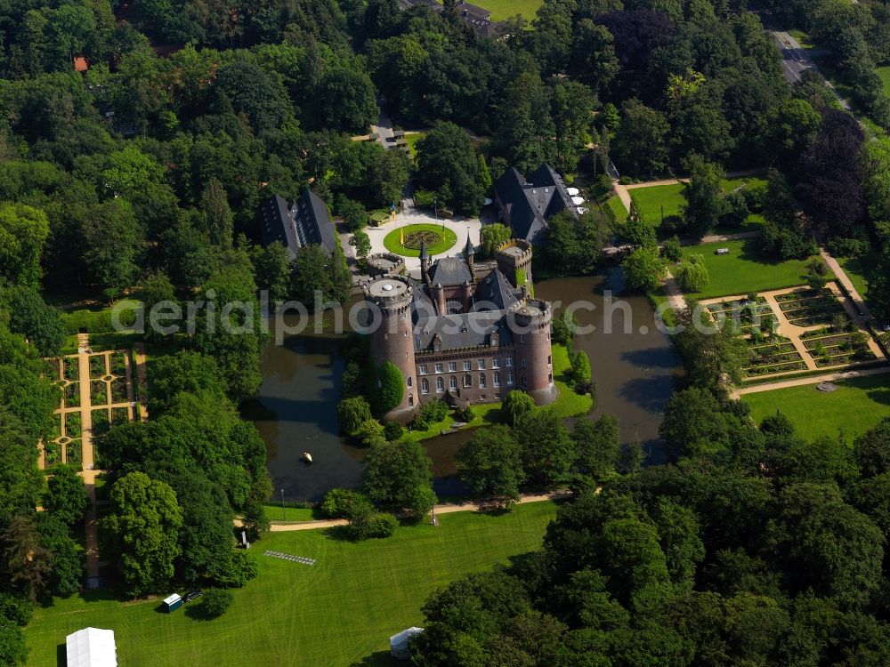 Bedburg-Hau from above - Castle Moyland in Bedburg-Hau in the state of North Rhine-Westphalia. The water castle is one of the most important neo-gothic buildings in the state. It is home to the collection of contemporary art by the Van der Grinten Brothers. The compound consists of a four-winged main palace with towers and battlements and roof terraces as well as outbuildings. Additionally, there is a gate building and a renovated castle park