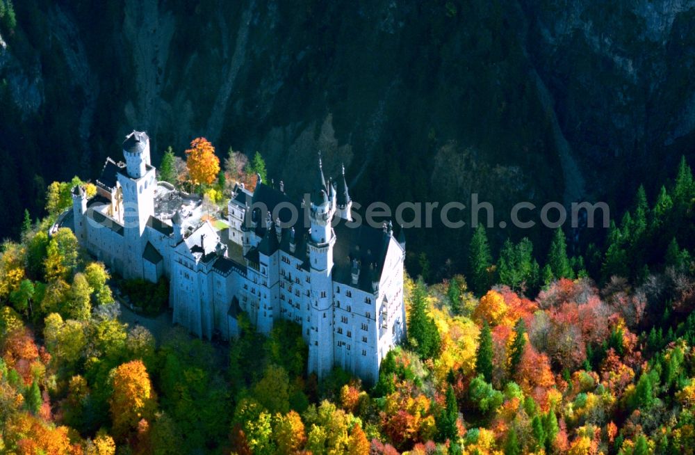 Hohenschwangau from above - Neuschwanstein Castle in Hohenschwangau in the state of Bavaria. The castle was built in the 19th century for Ludwig II of Bavaria. Today, the owner is the free state and the castle is one of the most famous landmarks in Germany and a beloved tourism site. Built in a historism style, it is also called a fairy tale castle