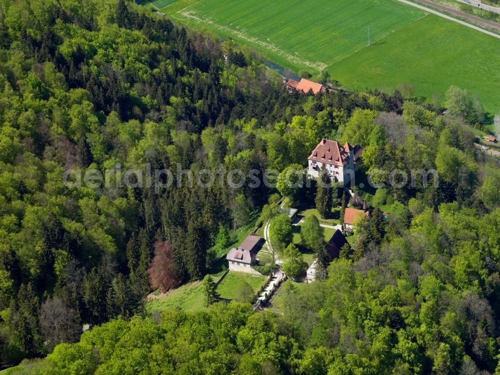 Hütten from above - Castle Neusteußlingen in the borough of Hütten in the Alb-Danube-Region of the state of Baden-Württemberg. The castle is located on a hill surrounded by forest above the Schmiech Valley. It can be traced back to a fortress of the 13th century. It is Wolfgang Gerberely owned today