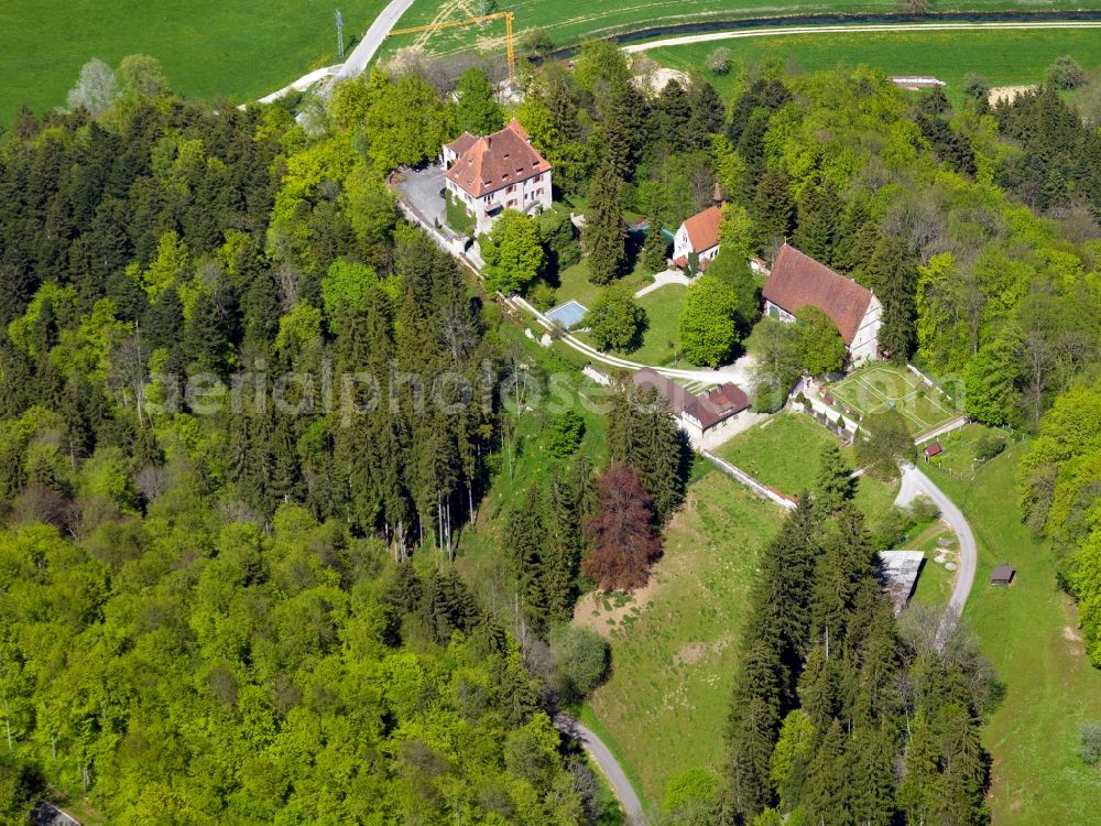 Hütten from the bird's eye view: Castle Neusteußlingen in the borough of Hütten in the Alb-Danube-Region of the state of Baden-Württemberg. The castle is located on a hill surrounded by forest above the Schmiech Valley. It can be traced back to a fortress of the 13th century. It is Wolfgang Gerberely owned today