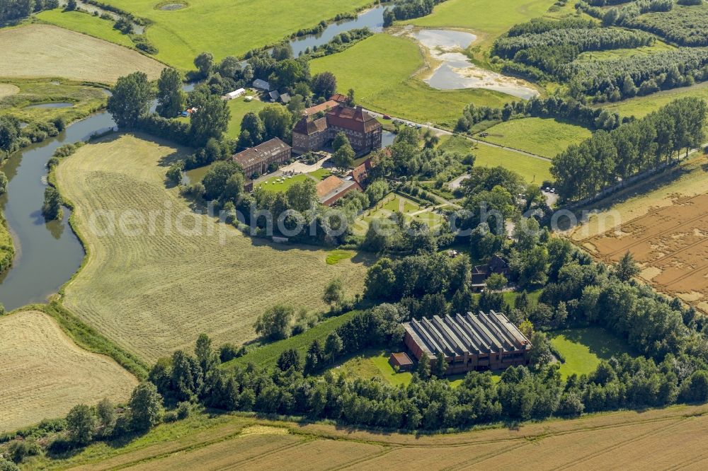 Aerial photograph Hamm - View at the water castle Oberwerries at the Lippeauen in the district Heessen in Hamm in the federal state of North Rhine-Westphalia NRW. In the castle are among others a profession school camp and today's sports and training center of the Westphalian Gymnastics Federation located