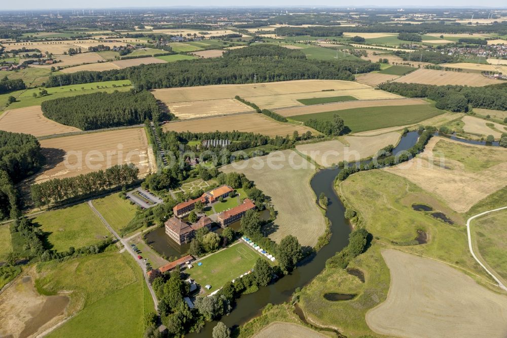 Hamm from the bird's eye view: View at the water castle Oberwerries at the Lippeauen in the district Heessen in Hamm in the federal state of North Rhine-Westphalia NRW. In the castle are among others a profession school camp and today's sports and training center of the Westphalian Gymnastics Federation located