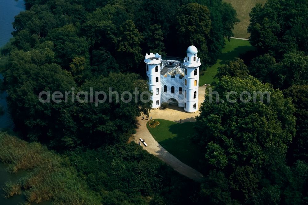 Aerial image Berlin - Castle Pfaueninsel (Peacock Island) on the island in the river Havel outside Berlin. The protected island is a landscape part and cultural heritage site of the UNESCO. It belongs to the foundation Stiftung Preussische Schloesser und Gaerten Berlin-Brandenburg. The white building with its two towers is located on the Western shores of the island