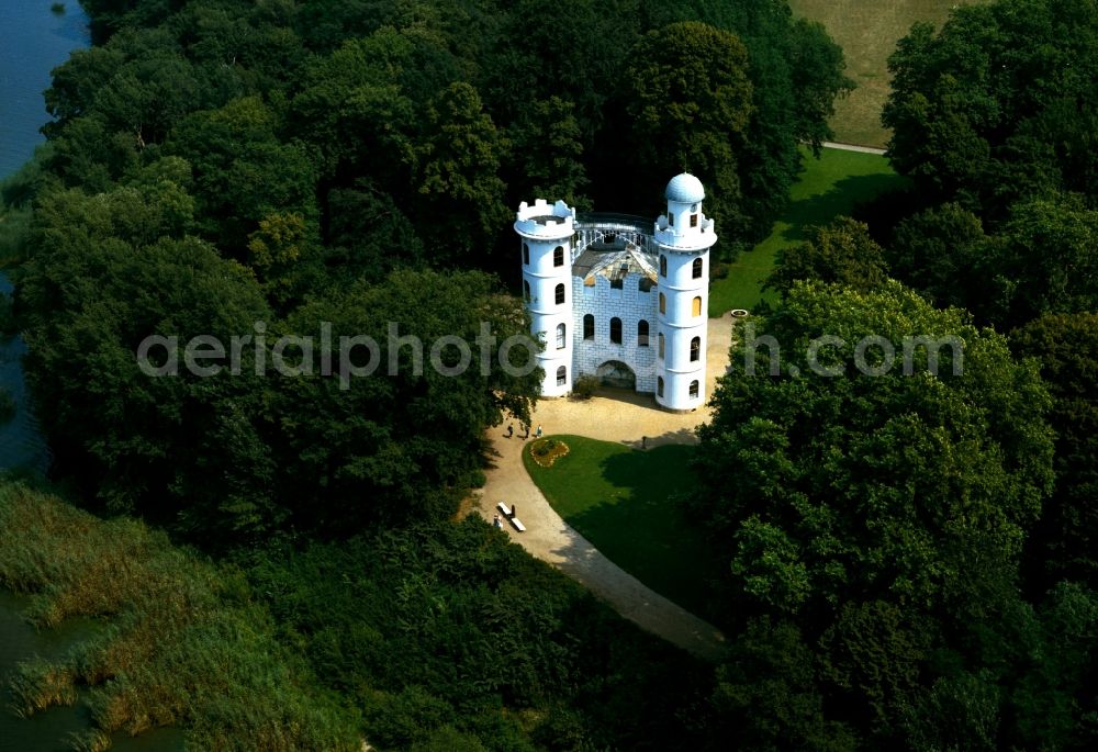 Berlin from above - Castle Pfaueninsel (Peacock Island) on the island in the river Havel outside Berlin. The protected island is a landscape part and cultural heritage site of the UNESCO. It belongs to the foundation Stiftung Preussische Schloesser und Gaerten Berlin-Brandenburg. The white building with its two towers is located on the Western shores of the island