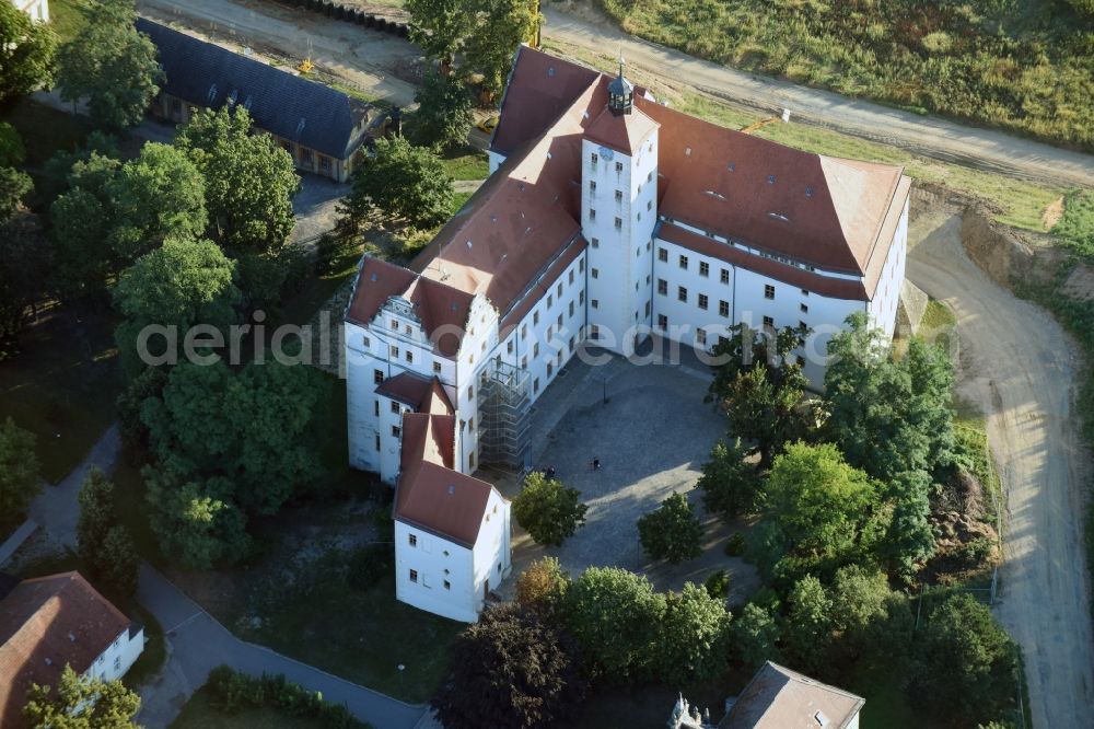 Pretzsch (Elbe) from the bird's eye view: Palace of Pretzsch (Elbe) in the state of Saxony-Anhalt. The castle from the 16th century with its central tower is located in the castle park on the edge of the village