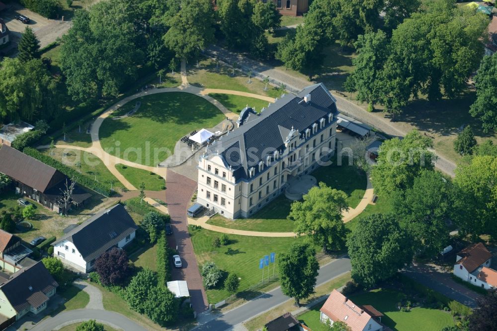 Aerial image Nauen - View of the Ribbeck part of the town of Nauen in the state of Brandenburg. The town is located in the county district of Havelland. Ribbeck is known for the castle from the 19th century, located in its centre. The historic building is surrounded by a park