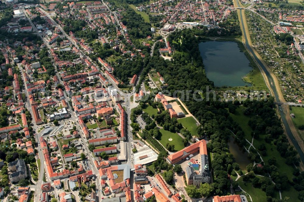 Aerial image Sondershausen - The Sondershausen Castle in Thuringia is at the center of the city. The sight in the neo-classical style was once the residence of the princes of Schwarzburg-Sondershausen. Today the castle is used as a palace and city museum and part of the Thuringian Foundation of Palaces and Gardens. In the former Prince House today the District Office has its seat. Octagonal house, stables and carriage house used by the State Music Academy Sondershausen. The large pond in Castle Park, a park in the style of an English landscape park, is the Haus der Kunst. The ZOB bus station Sondershausen is located on the Ulrich von Hutten Street