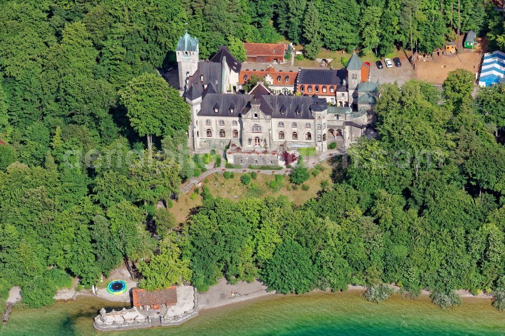 Berg from above - Schloss Seeburg near Muensing in the state of Bavaria. The former Biberkor castle on the banks of the Starnberger See between Allmannshausen and Weipertshausen is a listed monument. The burgundy complex with bay windows, tower, Bergfried, chapel and secondary buildings is used by the Christian children's and youth work of the free religious community Wort des Lebens