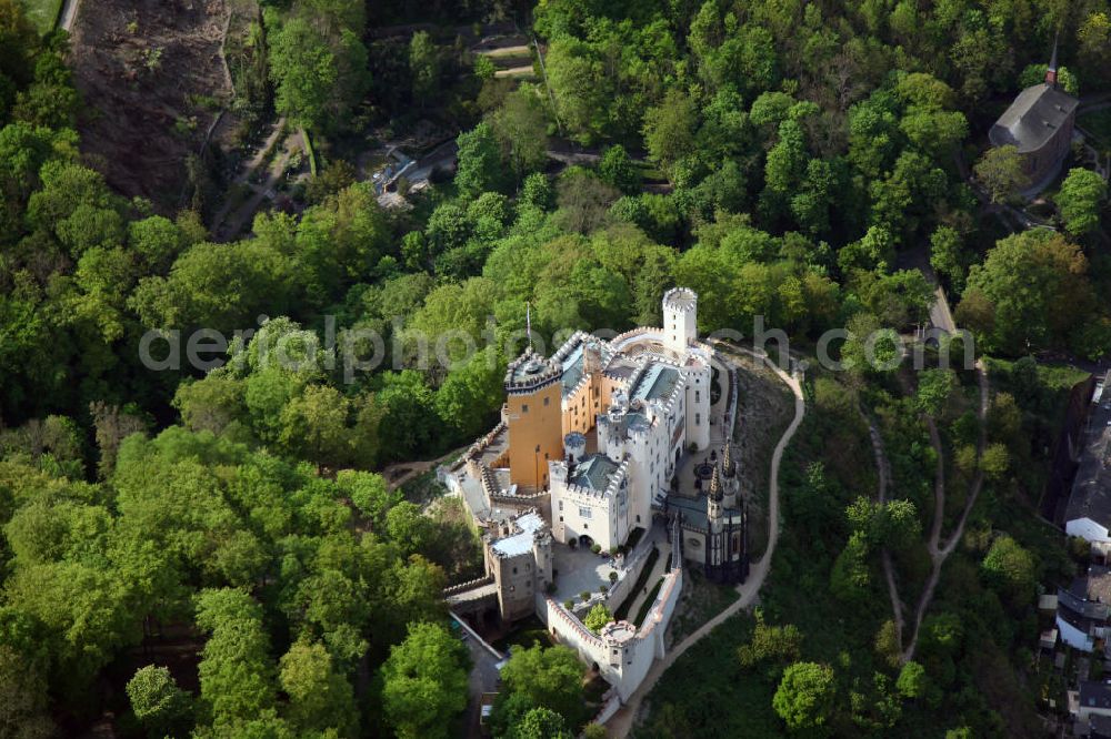 Aerial photograph Koblenz Stolzenfels - Blick auf das Schloß Stolzenfels im gleichnamigen Stadtteil von Koblenz gegenüber von Lahnstein an der Mündung der Lahn. Das Schloss Stolzenfels ist eine ehemalige Zollburg der Trierer Erzbischöfe, erbaut 1242 - 1259. Nach Zerstörung und Verfall wurde die Burg durch den Koblenzer Architekten Johann Claudius von Lassaulx im Stil der Rheinromantik als Schloss wieder aufgebaut. Castle Stolzenfels in the eponymous district of Koblenz.