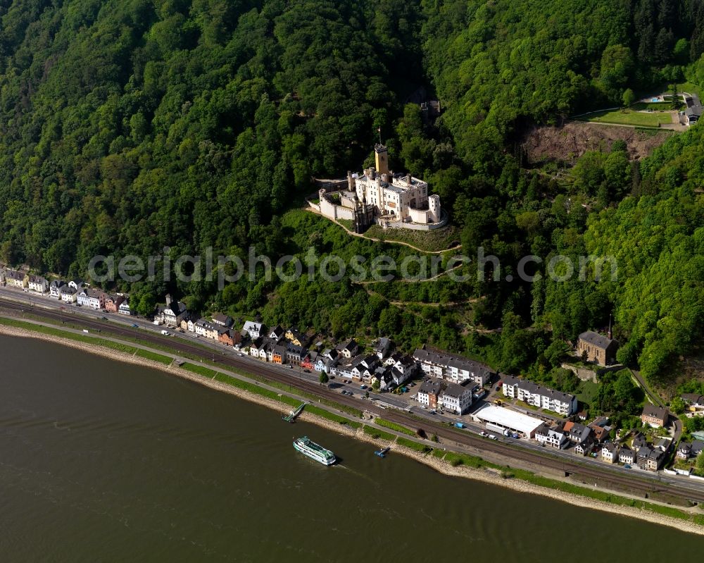 Aerial image Koblenz - Stolzenfels Castle in Koblenz in the state Rhineland-Palatinate. The castle is located on the riverbank of the river Rhine, opposite Lahnstein. The former fortress was rebuilt as a castle in the Rhine romantic style. Railway tracks run in front of it