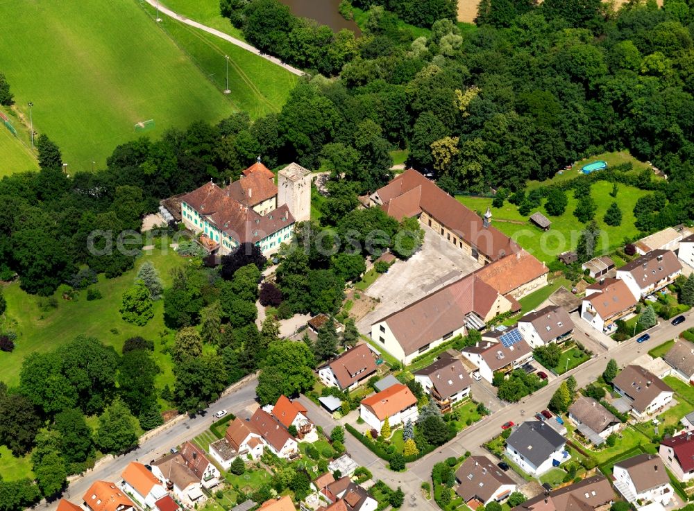 Aerial photograph Unterriexingen - Unterriexingen Castle in Unterriexingen in the state of Baden-Württemberg. The castle is located above Enz Valley and is based on a fortress from the 12th century. Today it is home of an animal shelter, the animal castle hotel. The castle is located in a residential area