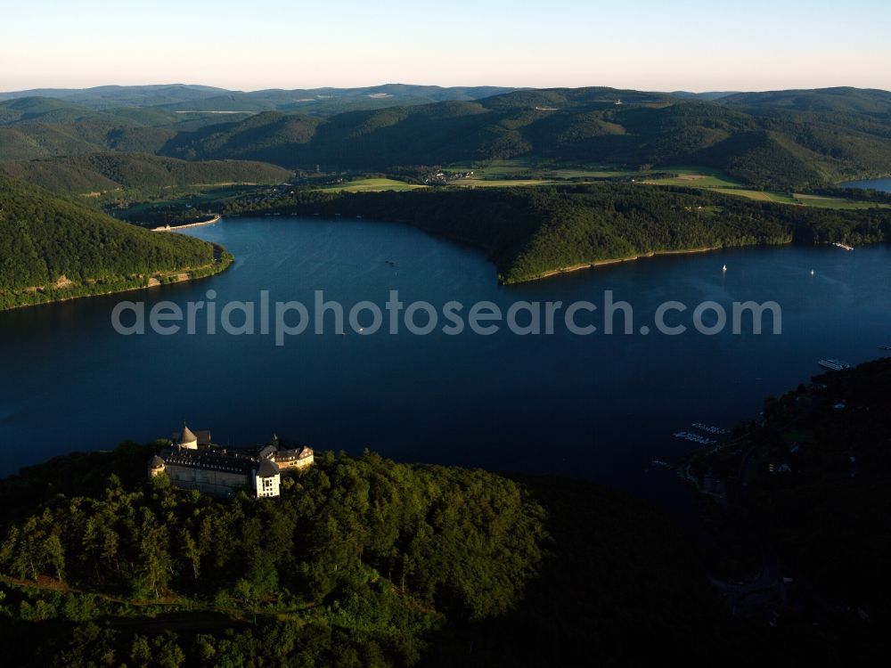 Aerial image Waldeck - Castle Waldeck on Lake Edersee in Waldeck in the state of Hesse. The former fortress from the 12th century is located in the Nature Park Kellerwald-Edersee and offers a panoramic view of the lake. The compound consists of a courtyard, pulver tower and castle keep. Today it consists of a museum, hotel and restaurant and is connected to the lake by a cable car