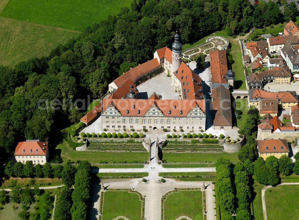 Weikersheim from the bird's eye view: Castle Weikersheim in the town of Weikersheim in the Tauberfranken region in the state of Baden-Württemberg. The castle is located in the West of the town center. Its park is adjacent to the town park. The compound was originally built in the 12th century and is now used as a museum, event location and for markets