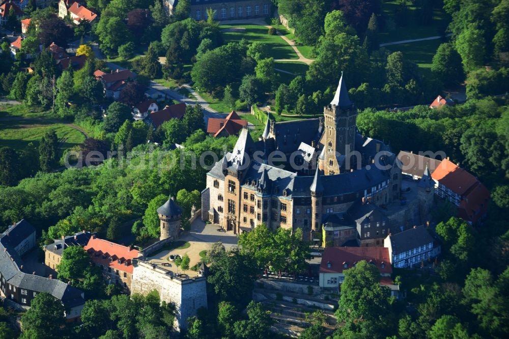 Wernigerode from the bird's eye view: View of the Wernigerode Castle in Wernigerode in the state Saxony-Anhalt. The Wernigerode Castle is located in the Harz mountains. Today it houses a popular museum