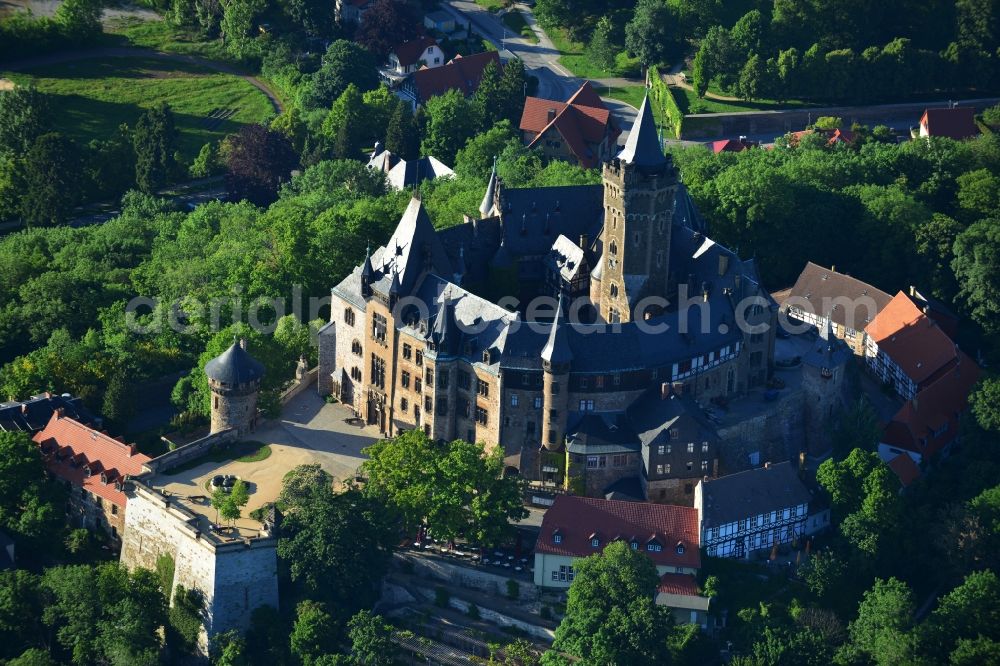 Aerial image Wernigerode - View of the Wernigerode Castle in Wernigerode in the state Saxony-Anhalt. The Wernigerode Castle is located in the Harz mountains. Today it houses a popular museum