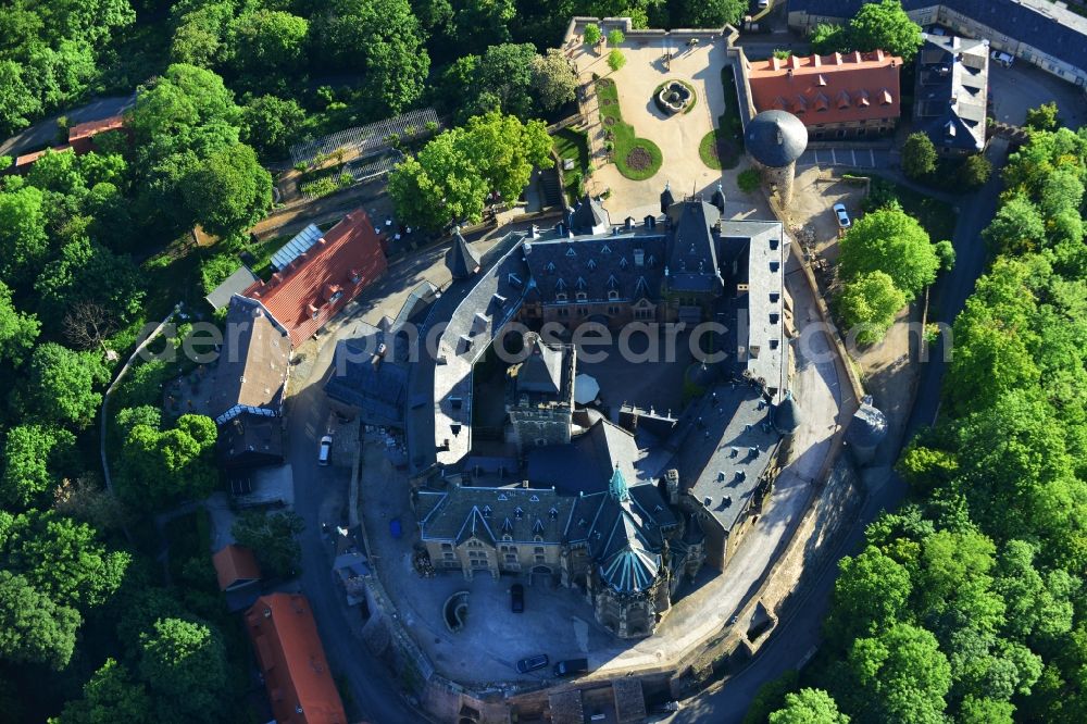 Aerial photograph Wernigerode - View of the Wernigerode Castle in Wernigerode in the state Saxony-Anhalt. The Wernigerode Castle is located in the Harz mountains. Today it houses a popular museum