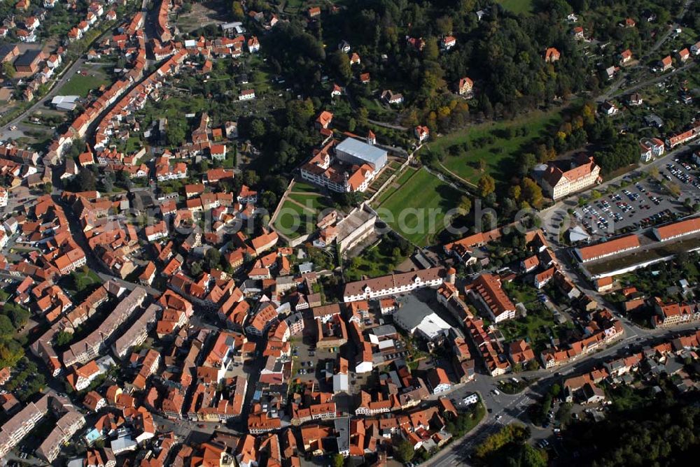 Aerial photograph Schmalkalden - Blick auf die Stadt Schmalkalden und das Schloss Wilhelmsburg. Das Schloss gilt aufgrund seiner umfassend erhaltenen Außenanlagen, der originalen Raumstruktur mit farben-prächtigen Wandmalereien und herrlicher Stuckatur als bedeutendes Denkmal der Renaissance-Baukunst. Kontakt: Schlossberg 9, 98574 Schmalkalden; Tel. 03683/ 403186