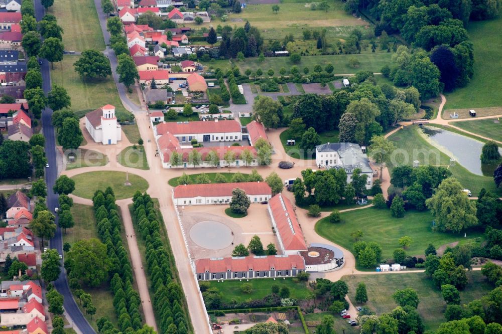 Neuhardenberg from the bird's eye view: Views of the Castle Hotel and the Schinkel Church in Neuhardenberg in the Federal State of Brandenburg. The Stiftung Schloss Hardenberg new GmbH is a wholly owned subsidiary of the German savings banks Association (DSGV) and was founded in 2001, around the DSGV bought and extensively renovated and refurbished Castle as a Center for culture, art, science and business ethics with a five-star hotel and rooms for meetings, to conferences and events