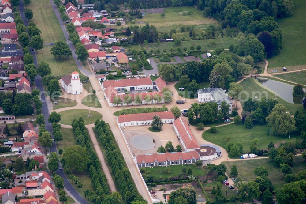 Neuhardenberg from the bird's eye view: Views of the Castle Hotel and the Schinkel Church in Neuhardenberg in the Federal State of Brandenburg. The Stiftung Schloss Hardenberg new GmbH is a wholly owned subsidiary of the German savings banks Association (DSGV) and was founded in 2001, around the DSGV bought and extensively renovated and refurbished Castle as a Center for culture, art, science and business ethics with a five-star hotel and rooms for meetings, to conferences and events