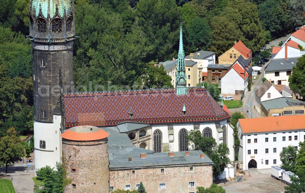 Aerial photograph Wittenberg - View over the tower on the southern wing of the castle of Wittenberg onto the church. At the church, Martin Luther spread his disputation in 1517 and caused the Reformation. The castle is part of UNESCO's world cultural heritage