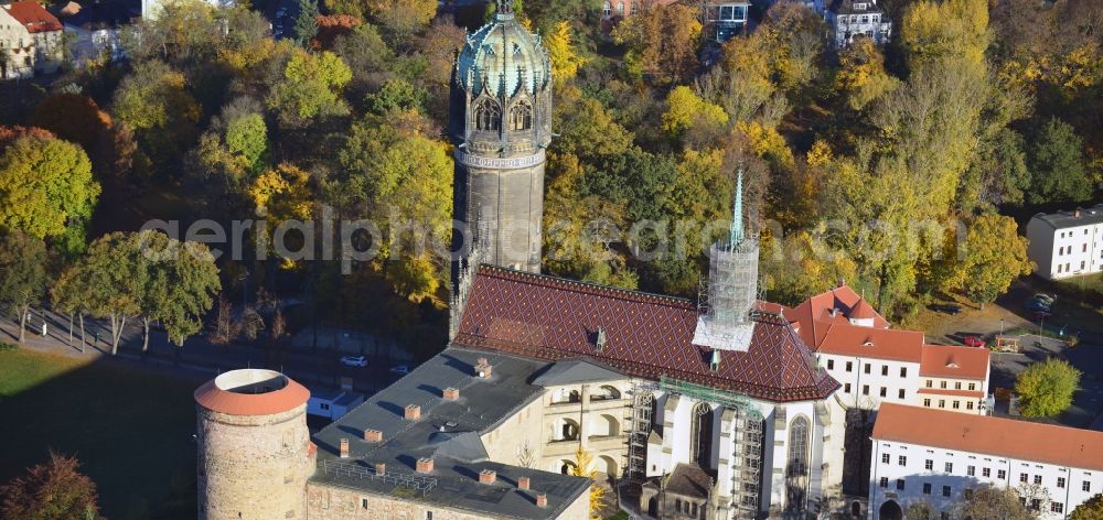 Aerial image Wittenberg - View over the tower on the southern wing of the castle of Wittenberg onto the church. At the church, Martin Luther spread his disputation in 1517 and caused the Reformation. The castle is part of UNESCO's world cultural heritage