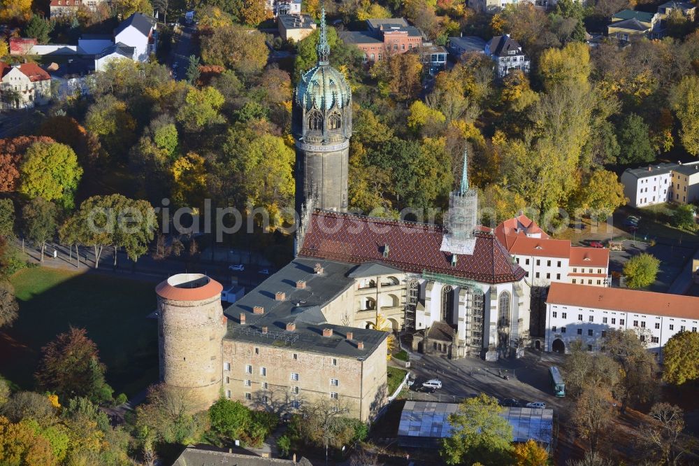 Aerial photograph Wittenberg - View over the tower on the southern wing of the castle of Wittenberg onto the church. At the church, Martin Luther spread his disputation in 1517 and caused the Reformation. The castle is part of UNESCO's world cultural heritage