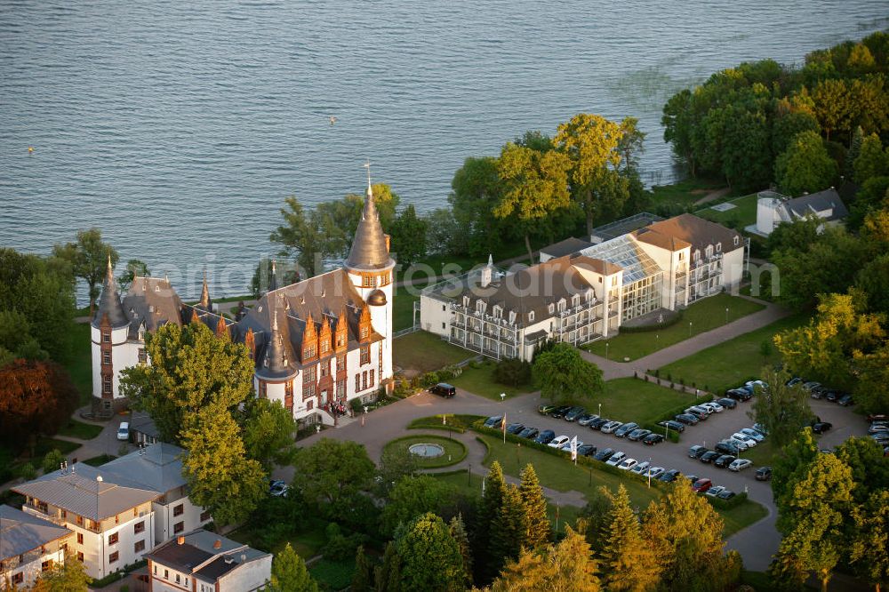 Aerial image Klink / Müritz - Sonnenaufgang am Schloßpark und das Schloßhotel Klink im gleichnamigen Erholungsort am Ufer der Müritz in Mecklenburg-Vorpommern. Castle Park and the Castle Hotel in Klink same resort on the shores of Lake Müritz in Mecklenburg-Vorpommern.