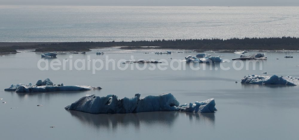 Kenai Fjords National Park from the bird's eye view: Melting glaciers remnants of Aialik Glacier floating in glacier lake in Kenai Fjords National Park on the Kenai Peninsula in Alaska in the United States of America USA