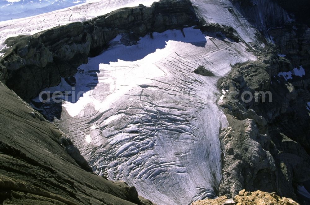 Aerial image Ormont-Dessus - Snow-covered hilltop of Les Diablerets in Ormont-Dessus in Switzerland