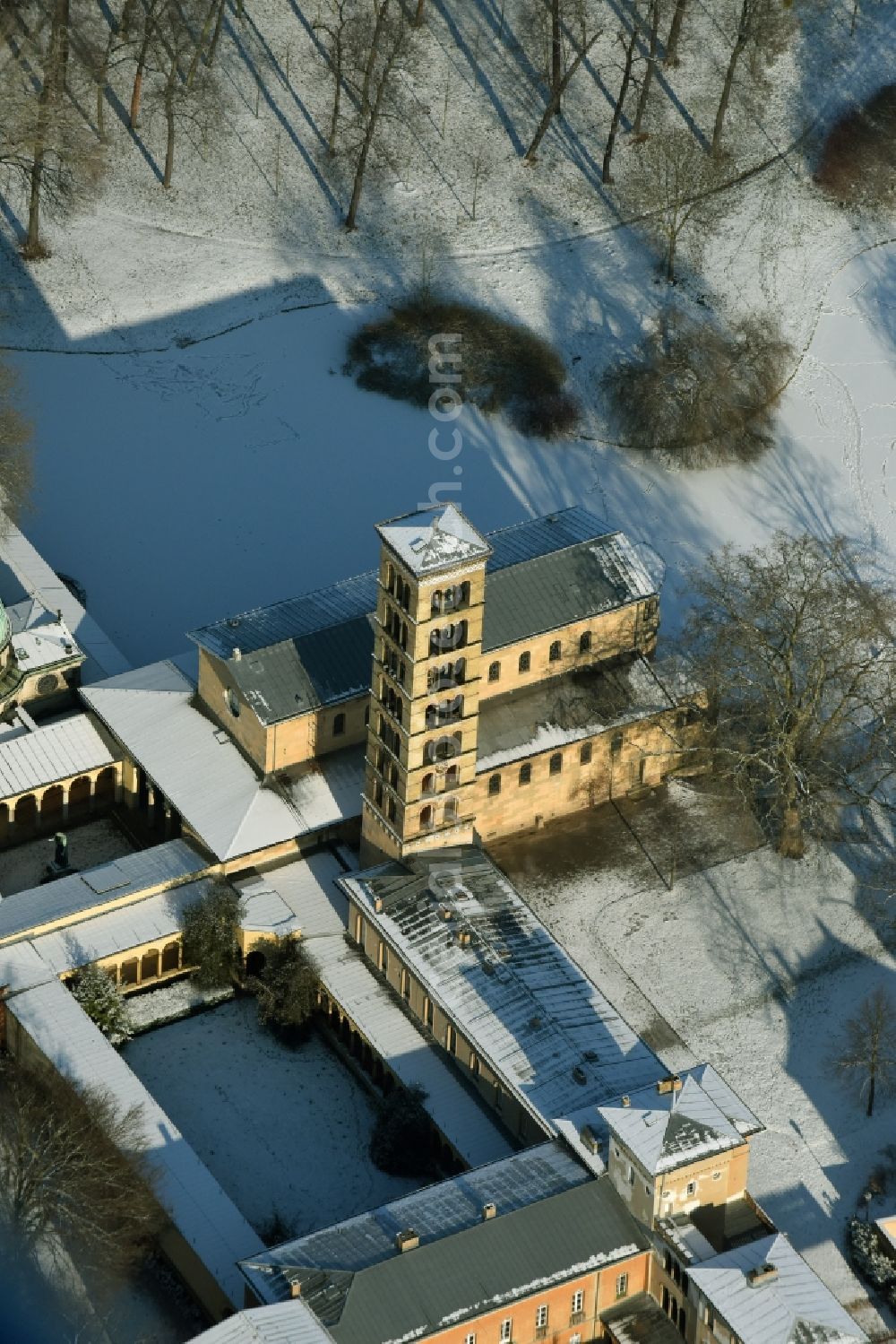 Aerial image Potsdam - Wintry snowy church building of the Peace Church on Maryl Gardens in the Sanssouci Park in Potsdam in the state of Brandenburg