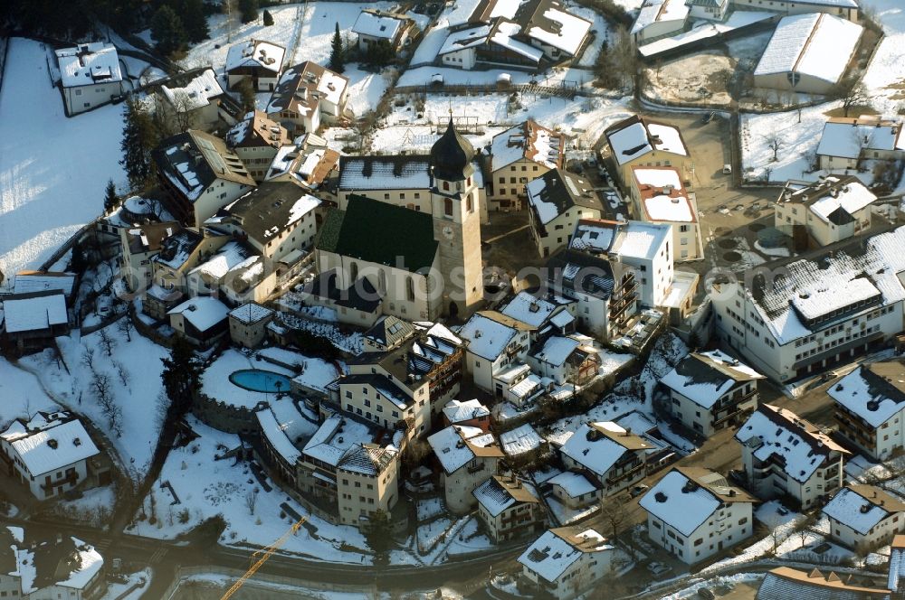 Aerial image Völs am Schlern - Fié allo Sciliar - Wintry snowy church building in Voels am Schlern - Fie allo Sciliar in Trentino-Alto Adige, Italy