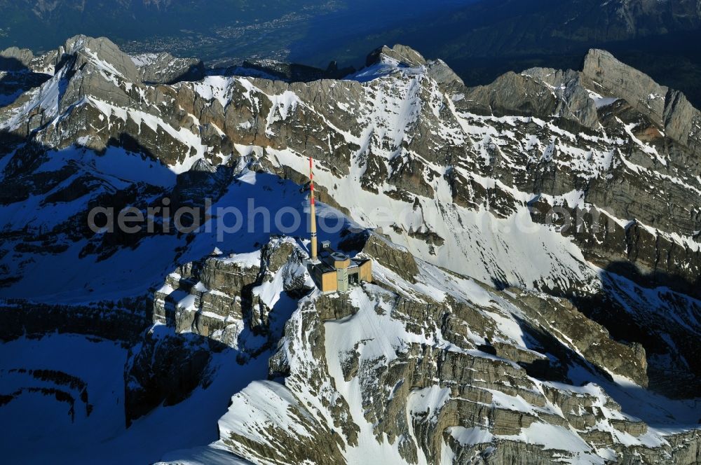 Säntis from the bird's eye view: Snow veiled mountain range Santis - Mountain in the Appenzell Alps in Switzerland