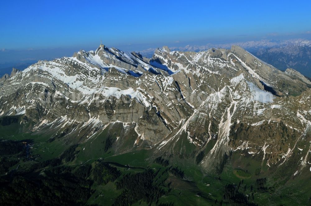 Aerial image Säntis - Snow veiled mountain range Santis - Mountain in the Appenzell Alps in Switzerland