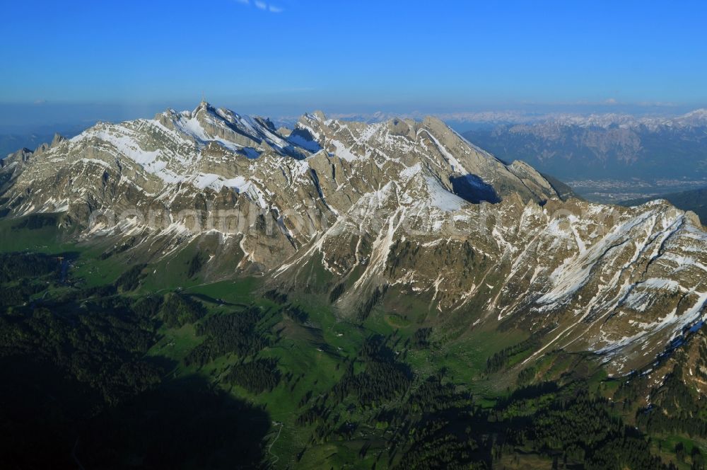 Säntis from the bird's eye view: Snow veiled mountain range Santis - Mountain in the Appenzell Alps in Switzerland