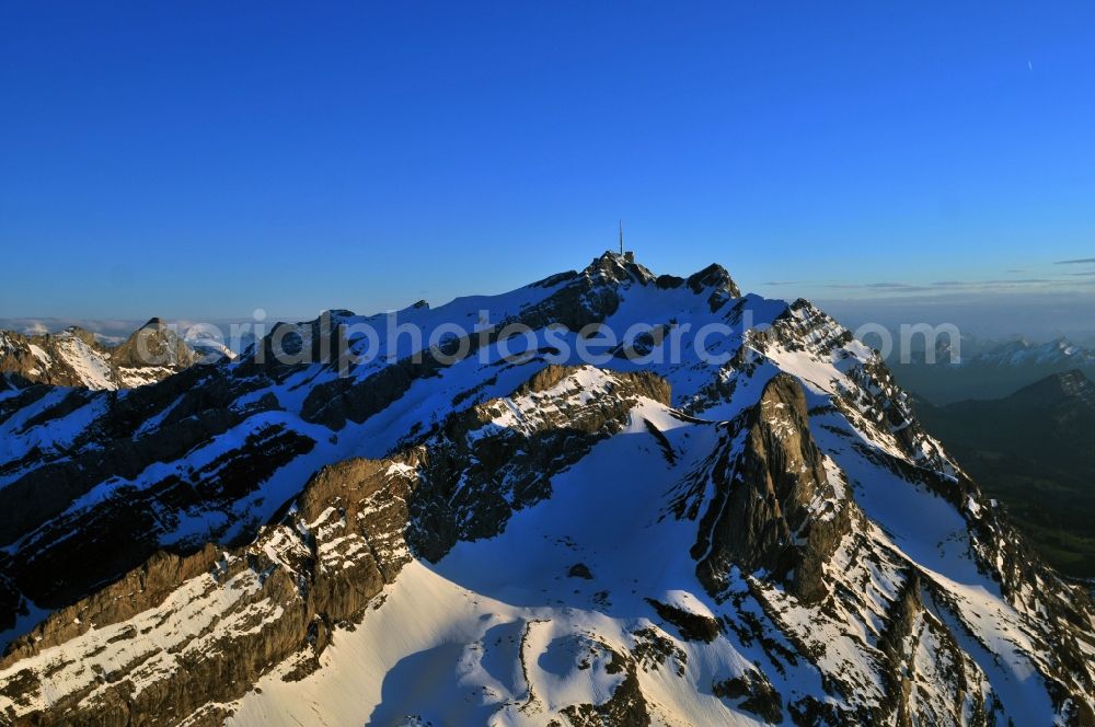 Säntis from the bird's eye view: Snow veiled mountain range Santis - Mountain in the Appenzell Alps in Switzerland