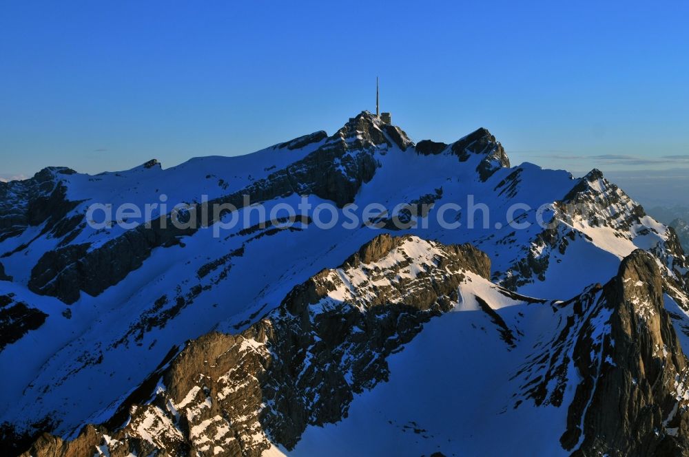 Aerial image Säntis - Snow veiled mountain range Santis - Mountain in the Appenzell Alps in Switzerland